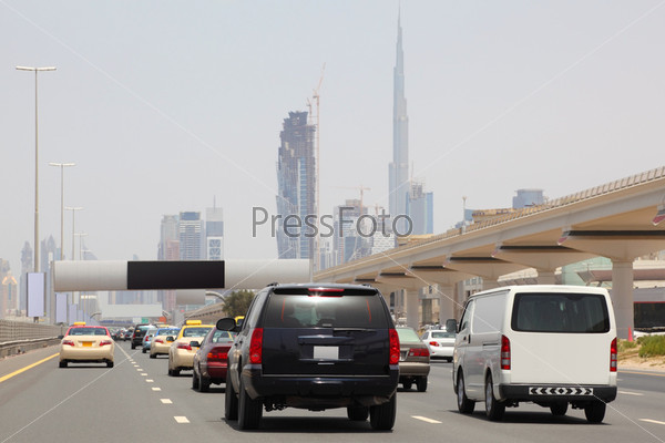 DUBAI - APRIL 18: general view on trunk road with many cars, skyscrapers and Burj Dubai,  April 18,  2010 in Dubai, UAE
