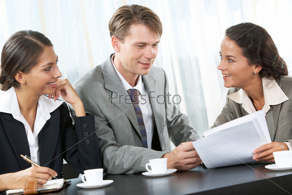 Portrait of business team interacting with each other in the office at meeting