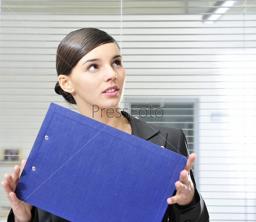 business woman holding reports inside office building. Copy space