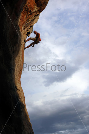 Silhouette of rock climber against