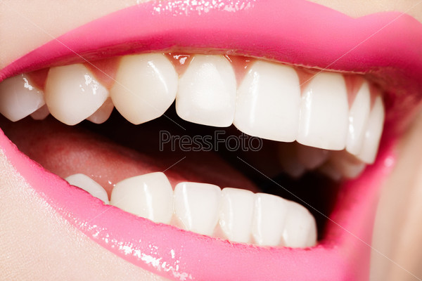 Macro happy woman\'s smile with healthy white teeth, bright gloss lips