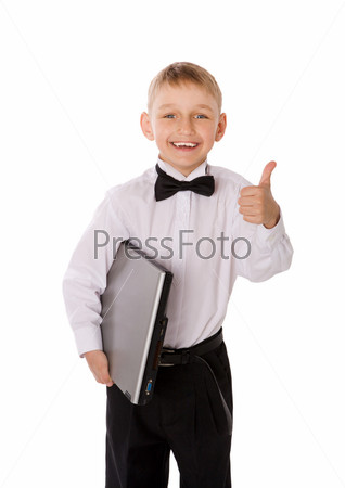 Six years Boy holding laptop isolated on white