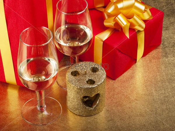 Two glasses and box with gifts