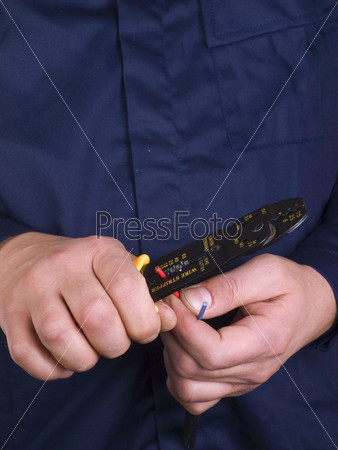 wire stripper   in the hands of worker