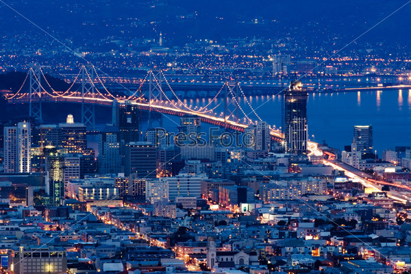 San Francisco bridges at night aerial view from Twin Peaks.