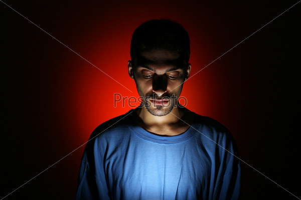 Dramatic dark portrait of young man