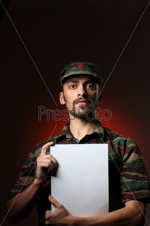 Soldier holding white board