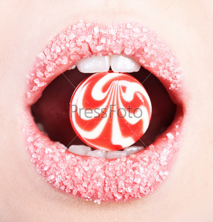A lollipop in the mouth (close-up)