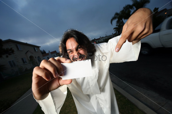 Crazy looking man showing his blank business card.