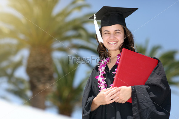 Happy graduate with diploma. Closeup, shallow DOF.