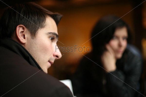 Young couple having a silent moment together. Shallow DOF.