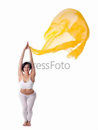 young woman doing yoga exercise and flying veil