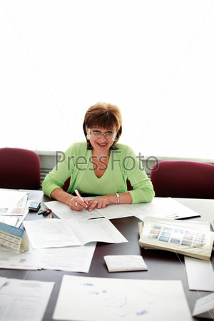 Business woman working with papers on table