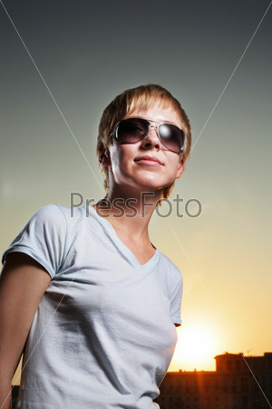Portrait of cool young woman at sunset