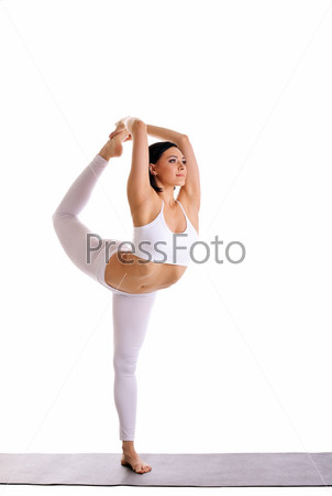 young pretty woman doing yoga asana -Dancer Pose on mat\
isolated
