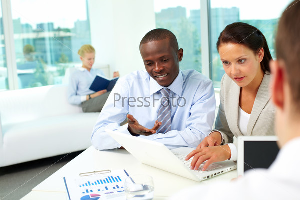Portrait of two business partners networking in office