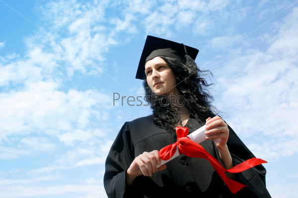 Happy graduate student in cloak with diploma