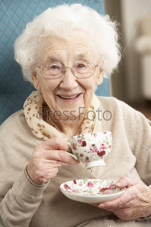 Senior Woman Enjoying Cup Of Tea At Home