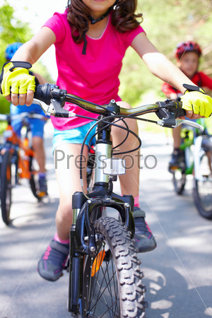 Close-up of children?s bike ridden by a girl