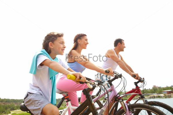 A family of three cycling together