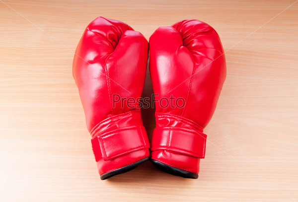 Red boxing gloves on the background