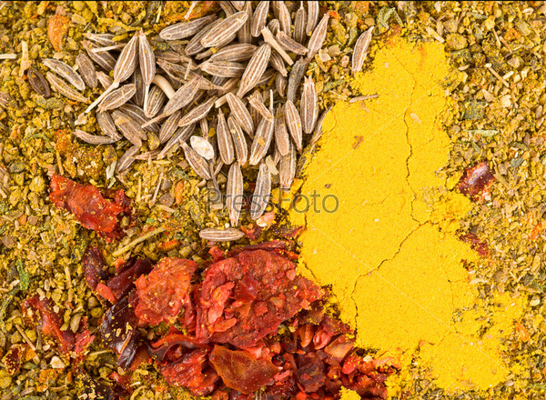 Zira seeds with crushed dried chillies and curry, stock photo