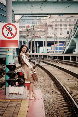 girl waiting for train on platform