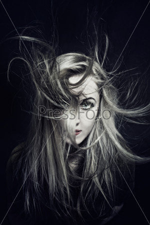woman with hair fluttering in wind closeup