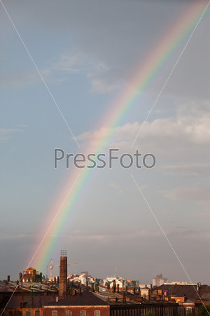 Multi color spectrum nature rainbow on rain cloud sky, stock photo