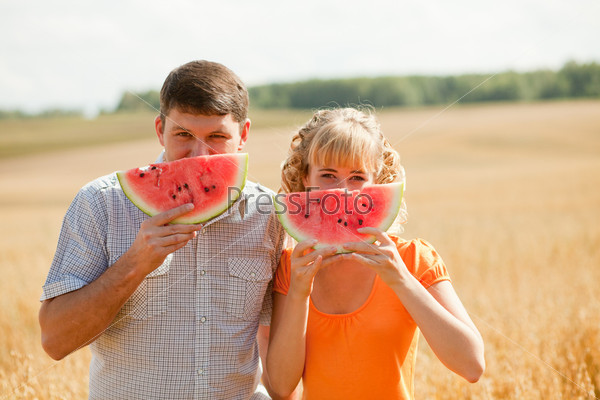 people eat watermelon and enjoy