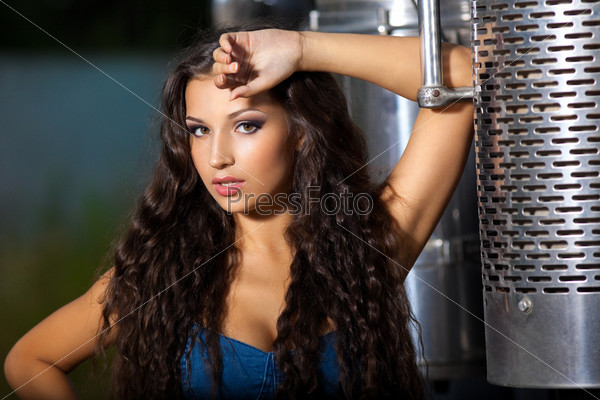 Young pretty girl portrait near steel truck