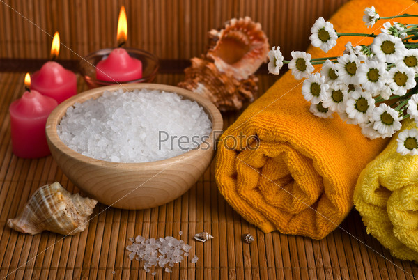 Spa style Towel with chamomile, bowl of sea salt and candle
