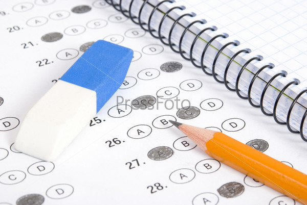 Test score with pencil, notebook and eraser