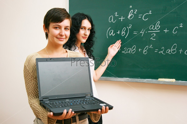 Two students at the lesson with laptop
