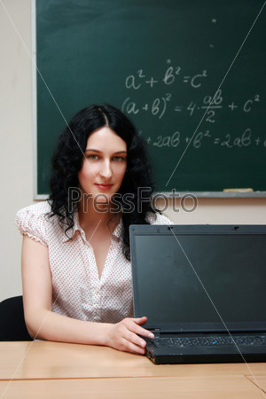 Girl at the lesson with laptop, stock photo