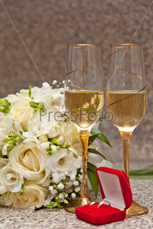 Wedding bouquet, rings and champagne