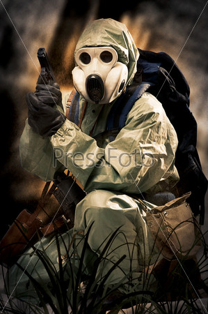 Post apocalypses world halloween concept. Portrait of man in gas mask. Protective military chemical warfare suit