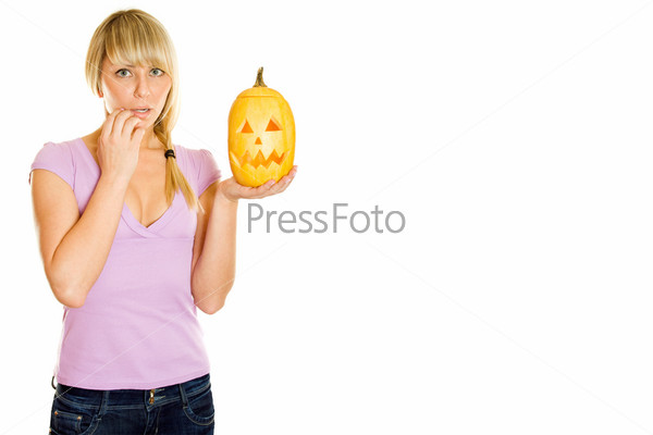 Young woman frightened with pumpkin for Halloween. Lots of copyspace and room for text on this isolate