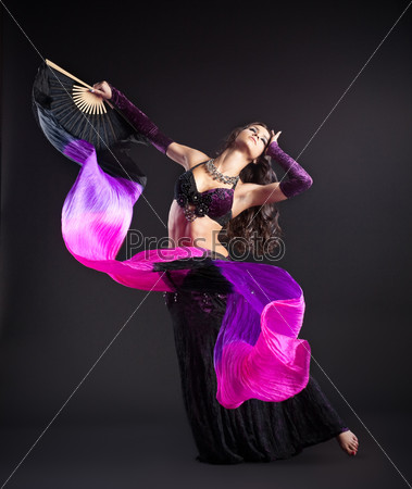 beauty girl in arabic costume dance with fantail