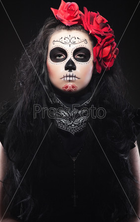 woman with roses dressed up for All Souls Day