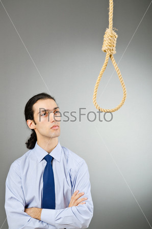 Businessman with thoughts of suicide, stock photo