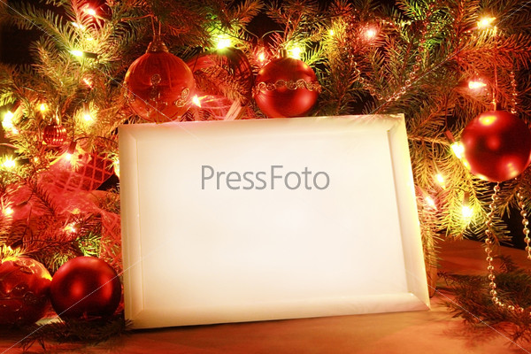 Colorful abstract background with Christmas lights and white frame.