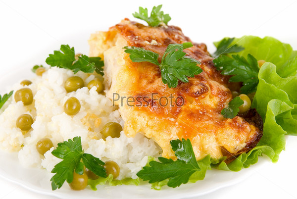 Close up of Tasty Chicken baked with pineapple and cheese dish with rice vegetables garnish