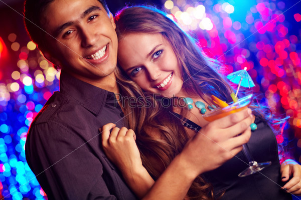 Image of happy couple at party in the night club