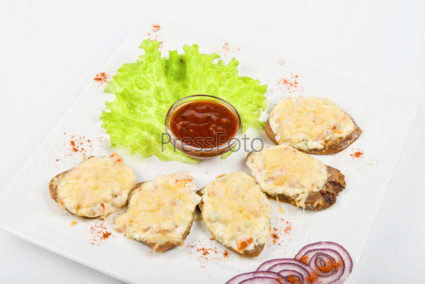 Baked beef tongue with cheese and vegetable with Salad Leaf and sauce isolated on white background