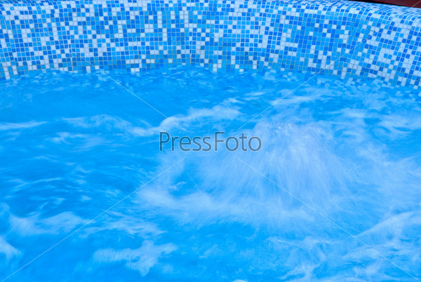 Abstract blue water background of hot whirlpool, stock photo