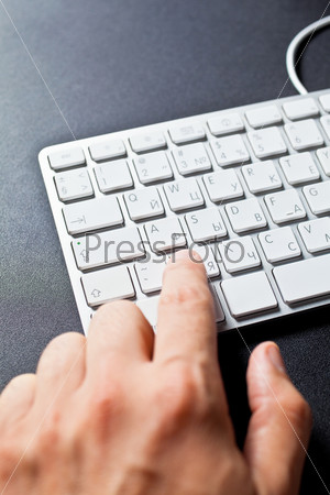 A man typing on a keyboard/ Man typing on keyboard
