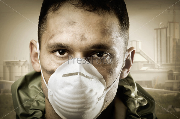 Post apocalypses world halloween concept. Portrait of young Sad man in breathing mask