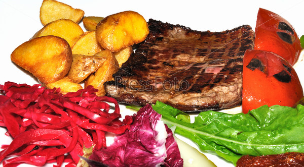 Meat main course served with mashed potato and vegetables, stock photo