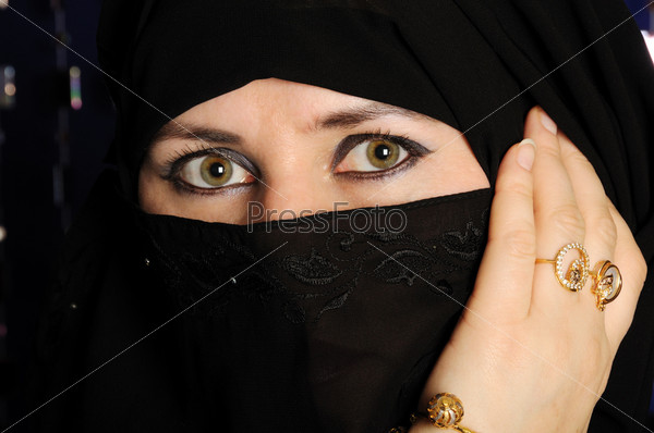 Close up picture of a Muslim woman wearing a black veil